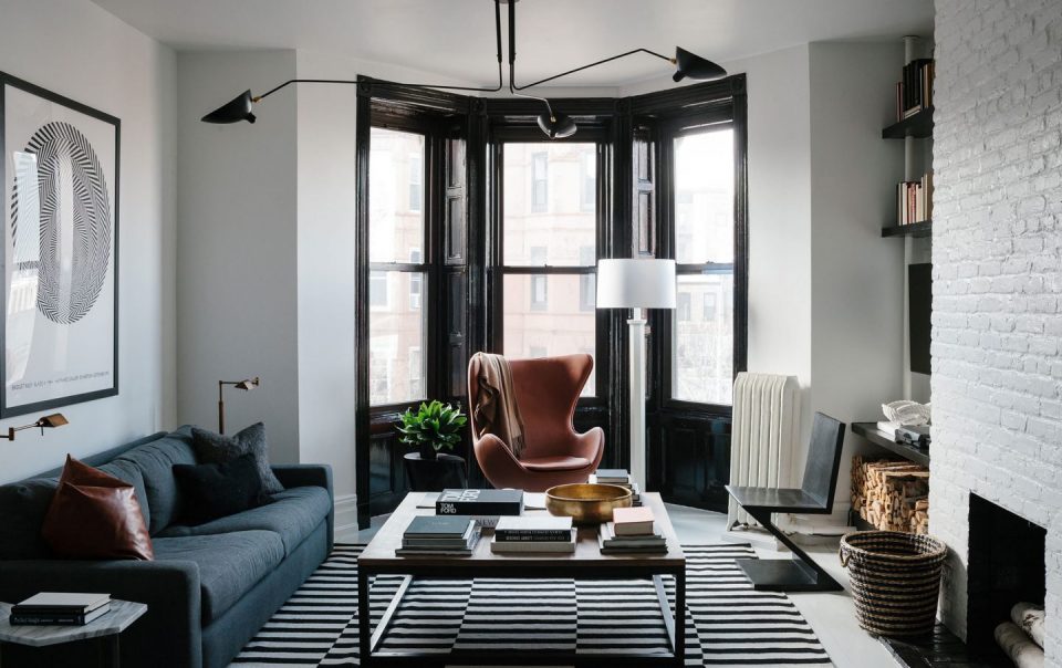 a black and white bachelor pad in brooklyn home tour lonny for brownstone apartment designer dan mazzarini melded historic architecture modern masculine hotel interior black and white hotel hotel desi